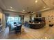 Inviting living room featuring an open layout with plenty of natural light and seamless access to the outdoor area at 25863 Crossings Bluff Ln, Sorrento, FL 32776