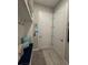 Welcoming mudroom with a built-in bench, storage shelves, and coat hooks at 25863 Crossings Bluff Ln, Sorrento, FL 32776
