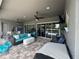 Spacious covered outdoor patio with ceiling fans and comfortable outdoor furniture at 25863 Crossings Bluff Ln, Sorrento, FL 32776