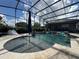 Screened in swimming pool featuring a tanning ledge and water feature at 25863 Crossings Bluff Ln, Sorrento, FL 32776