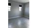 Bedroom with tile flooring, neutral paint, and two windows with blinds at 2609 Village Lakes Blvd, Lakeland, FL 33805