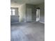 Upstairs bonus room provides extra living space with neutral paint and carpet, plus hall access to bedrooms at 2609 Village Lakes Blvd, Lakeland, FL 33805