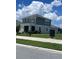 Lovely two-story home showcasing well-maintained landscaping and a tidy mailbox at 2609 Village Lakes Blvd, Lakeland, FL 33805