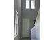 Bright foyer with high ceilings, a staircase, and natural light from multiple windows at 2609 Village Lakes Blvd, Lakeland, FL 33805