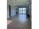 Spacious living room with large windows providing natural light and serene lake views at 2609 Village Lakes Blvd, Lakeland, FL 33805