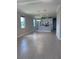 Open-concept living and kitchen area featuring tile flooring and modern finishes at 2609 Village Lakes Blvd, Lakeland, FL 33805