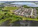 Aerial view of a lakeside community with lush green areas and beautiful water views at 2740 Rochelle Dr, Winter Haven, FL 33881