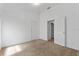 Well-lit bedroom with neutral carpet, open doorways, and ample space at 2740 Rochelle Dr, Winter Haven, FL 33881