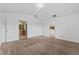 Spacious bedroom with neutral carpet, multiple doors, with a view into the bathroom and kitchen at 2740 Rochelle Dr, Winter Haven, FL 33881