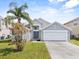 Attractive two-story home featuring a two-car garage, well-manicured lawn and curb appeal at 2740 Rochelle Dr, Winter Haven, FL 33881