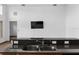 Kitchen sink with granite countertops and stainless-steel faucet with a mounted television on the wall at 2740 Rochelle Dr, Winter Haven, FL 33881