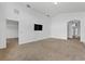 Bright and spacious living room featuring vaulted ceilings, neutral paint, and plush carpeting at 2740 Rochelle Dr, Winter Haven, FL 33881