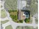This aerial view showcases a home with a backyard pool, lush greenery, and a well-maintained property at 2800 Sunset Nw Dr, Winter Haven, FL 33881
