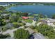 Aerial view of a neighborhood with well-maintained yards and mature trees at 2800 Sunset Nw Dr, Winter Haven, FL 33881