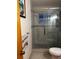 Bathroom featuring a glass-enclosed shower with updated fixtures and modern tile work at 2800 Sunset Nw Dr, Winter Haven, FL 33881