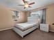 Bedroom with carpet floor featuring a bed, a ceiling fan and a window at 2800 Sunset Nw Dr, Winter Haven, FL 33881