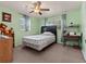 Comfortable bedroom features neutral walls, carpet flooring, and a ceiling fan at 2800 Sunset Nw Dr, Winter Haven, FL 33881