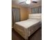 Simple bedroom with neutral walls, contemporary queen bed, and soft, light-filtering curtains at 2800 Sunset Nw Dr, Winter Haven, FL 33881