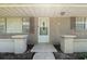 Charming entryway features a white front door and neutral brick exterior for a welcoming entrance at 2800 Sunset Nw Dr, Winter Haven, FL 33881
