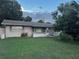 Charming single-story brick home featuring a well-maintained lawn and mature landscaping at 2800 Sunset Nw Dr, Winter Haven, FL 33881