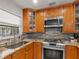 Kitchen featuring stainless steel appliances, granite counters, and backsplash at 2800 Sunset Nw Dr, Winter Haven, FL 33881