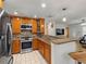 Spacious kitchen with stainless steel appliances and breakfast bar at 2800 Sunset Nw Dr, Winter Haven, FL 33881