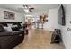 Inviting living room with a leather sectional and kitchen view at 2800 Sunset Nw Dr, Winter Haven, FL 33881