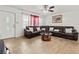 Cozy living room with a sectional couch and hardwood floors at 2800 Sunset Nw Dr, Winter Haven, FL 33881