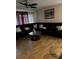 Inviting living room with tile flooring, modern ceiling fan, and a comfortable, oversized sectional sofa at 2800 Sunset Nw Dr, Winter Haven, FL 33881
