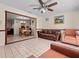 Bright living room with tile floors and views into the dining area at 2800 Sunset Nw Dr, Winter Haven, FL 33881