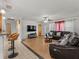 Open-concept living room with a leather sectional couch at 2800 Sunset Nw Dr, Winter Haven, FL 33881