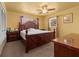 Spacious main bedroom with carpet flooring, ceiling fan, and a large window with curtains at 2800 Sunset Nw Dr, Winter Haven, FL 33881