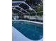 Refreshing screened-in pool with clean, clear water and lounging area at 2800 Sunset Nw Dr, Winter Haven, FL 33881