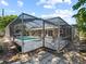 Relaxing screened-in pool area featuring comfortable lounge chairs and a clear view of the backyard at 2800 Sunset Nw Dr, Winter Haven, FL 33881