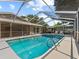 Beautiful in-ground pool with a large screened enclosure, perfect for year-round enjoyment and outdoor gatherings at 2800 Sunset Nw Dr, Winter Haven, FL 33881