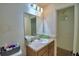 A bathroom with a vanity, sink, mirror, and lighting fixtures at 286 Cove At Eagle Lake Cir, Eagle Lake, FL 33839