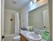 Standard bathroom with a shower-tub combo, single sink vanity, and a toilet at 286 Cove At Eagle Lake Cir, Eagle Lake, FL 33839