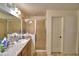 Well-lit bathroom features a walk-in shower, a vanity with ample countertop space, and tile flooring at 286 Cove At Eagle Lake Cir, Eagle Lake, FL 33839