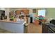 Kitchen with an island, laminate counters, wooden cabinetry, and stainless-steel appliances at 286 Cove At Eagle Lake Cir, Eagle Lake, FL 33839