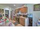 Kitchen featuring stainless steel appliances, wood cabinets and laminate countertops at 286 Cove At Eagle Lake Cir, Eagle Lake, FL 33839