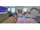 Bright main bedroom with a large bed, dresser, and bright natural light at 286 Cove At Eagle Lake Cir, Eagle Lake, FL 33839