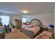 Spacious main bedroom with a large bed, side tables, and bright natural light at 286 Cove At Eagle Lake Cir, Eagle Lake, FL 33839