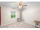 Bedroom featuring neutral walls, carpeted floor and a window overlooking the backyard at 2861 Pond View Dr, Haines City, FL 33844