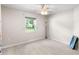 Carpeted bedroom with a ceiling fan, a bright window, and neutral colored walls at 2861 Pond View Dr, Haines City, FL 33844