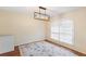 Dining room with light wood floors and an elegant chandelier with shuttered window at 2861 Pond View Dr, Haines City, FL 33844