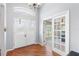 Bright foyer with decorative wood flooring, double front doors and french doors to the office at 2861 Pond View Dr, Haines City, FL 33844