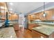 Bright kitchen with granite countertops, stainless steel appliances, and hardwood floors at 2861 Pond View Dr, Haines City, FL 33844