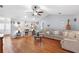Open concept living room with laminate flooring, a vaulted ceiling and lots of natural light at 2861 Pond View Dr, Haines City, FL 33844