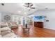Inviting living room with hardwood floors, ceiling fan, and sliding doors leading to the outside at 2861 Pond View Dr, Haines City, FL 33844