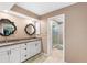 The main bathroom features double sinks, granite countertops, and a glass-enclosed shower at 2861 Pond View Dr, Haines City, FL 33844